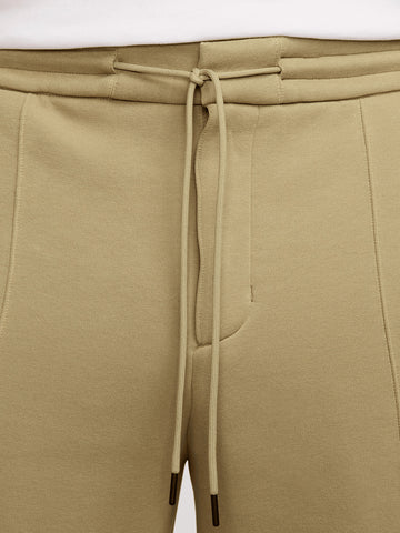 NIKE M Pantaloni sartoriali in fleece oliva Oliva